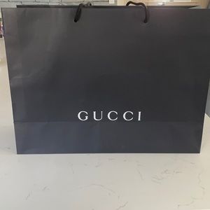Gucci paper shopping bag.